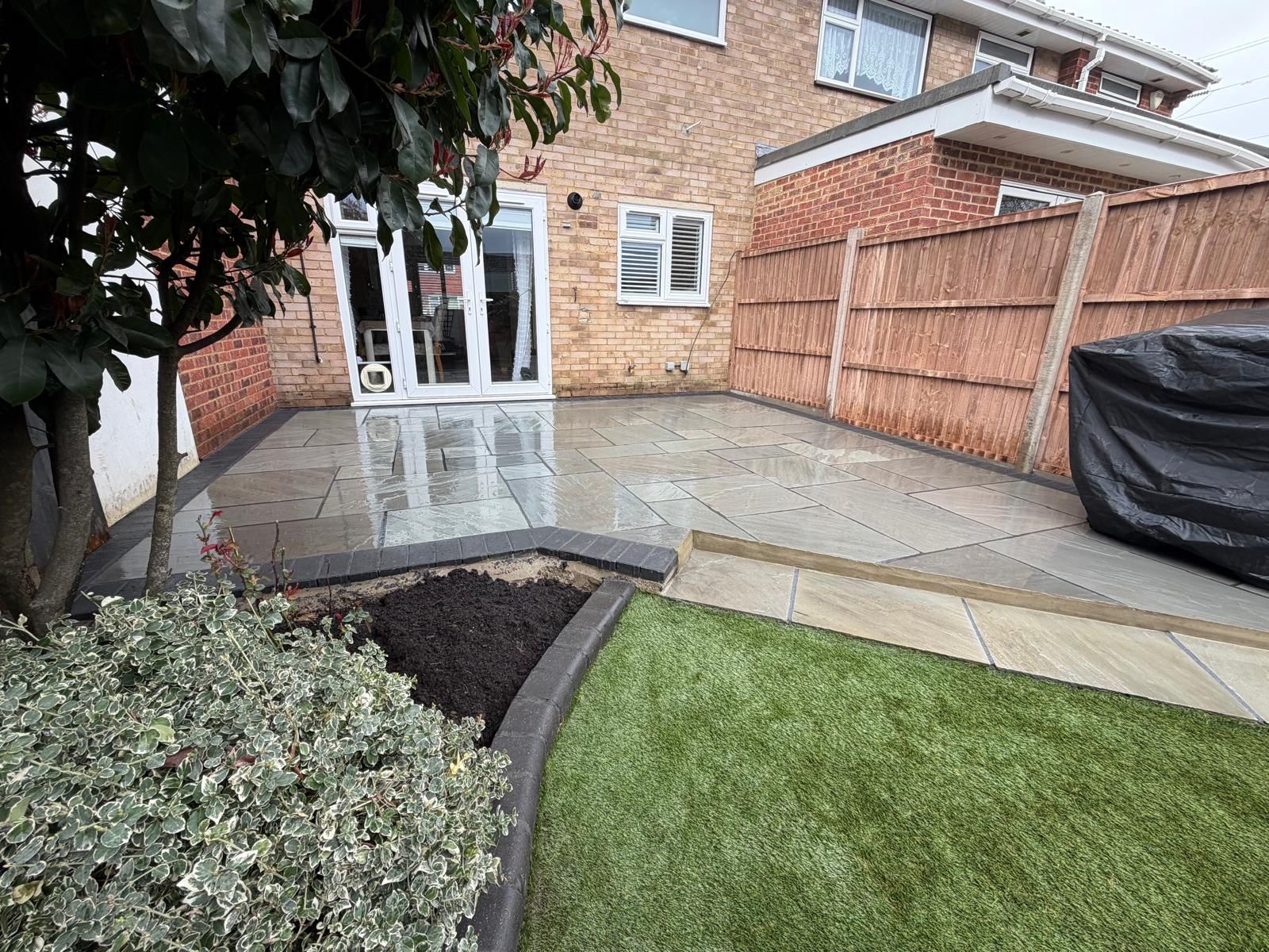Laura's full patio, lawn and planting area finished